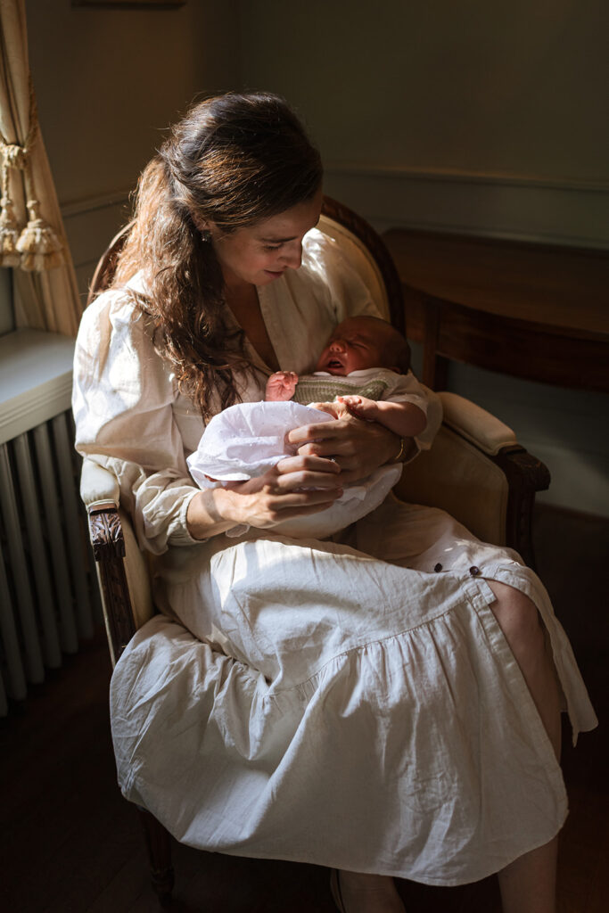 in-home newborn photo of mom and baby during family session