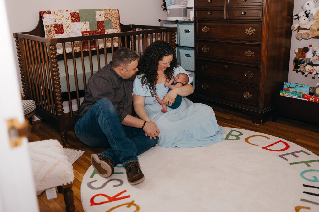 nursery shot of a family with newborn